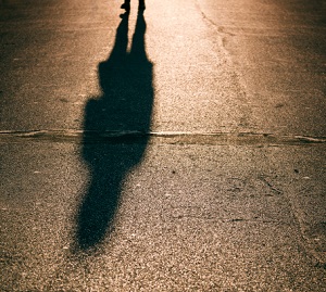 Man's shadow on the street