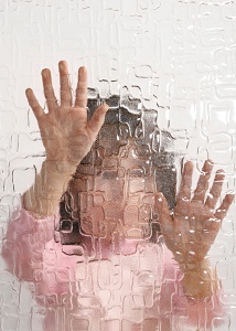 Child behind textured glass