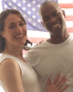 Couple in front of flag