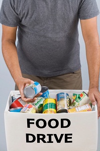 Man filling food drive box