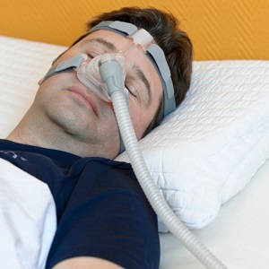 man with sleep apnea machine