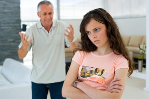 Father yelling at teen daughter