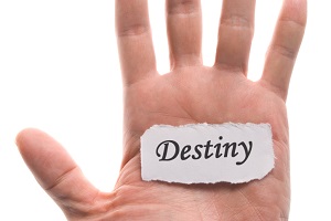 Hand with destiny written on paper