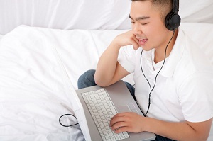 Man with keyboard and headphones