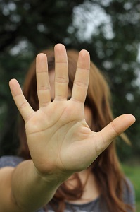 woman with hand in front of her face