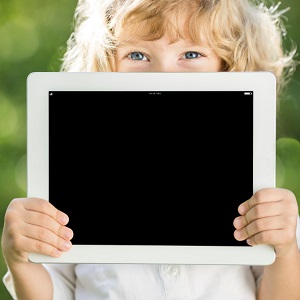 Child holding blank chalkboard