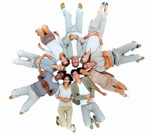 Group of people laying in circle