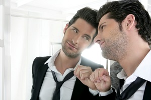 Man admiring himself in mirror