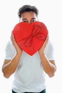 Man holding box of chocolates