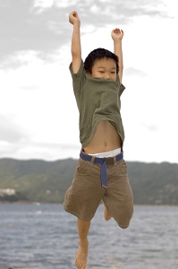 Boy jumping in water