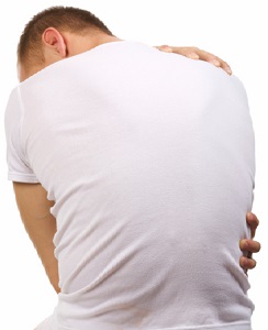 Man hugging self