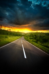 Stormy clouds over road