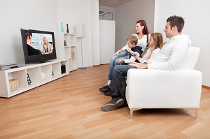 Family sitting and watching television