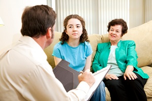 Mother and daughter with therapist