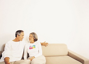 Older couple talking on couch