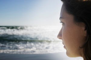 Woman looking over ocean