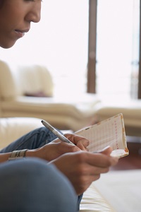 Woman writing in journal