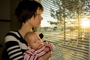 Young girl holding baby