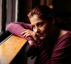 Woman Looking out of a Window