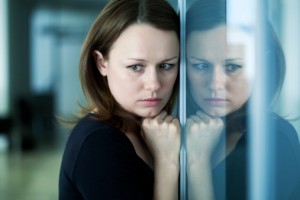 sad woman at the window