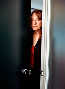 woman-behind-door-closeted-0611136
