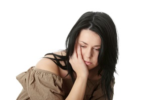Young corpulent woman with depression