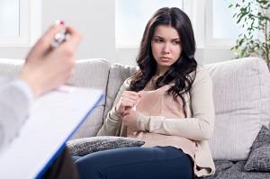 woman in therapy is feeling uneasy