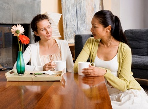 Friends share a cup of coffee together