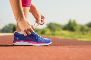 woman-tying-sports-shoe