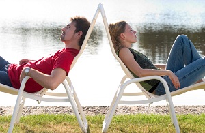 man-and-woman-lounging-with-backs-to-each-other