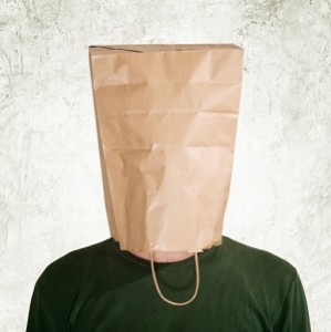 Man hidden behind a paper bag