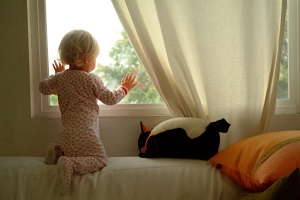 toddler-staring-out-window