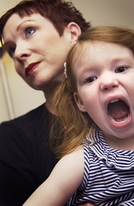 child-screaming-with-stressed-mother