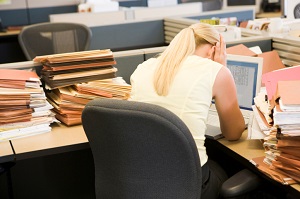 stressed woman in cubicle