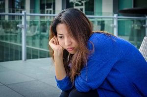 woman sitting and thinking