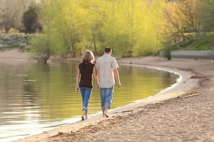 couple walking around lake