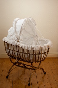 empty bassinet on floor