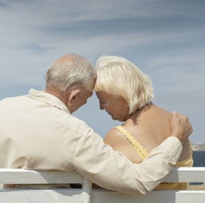 Elderly man and woman sitting together