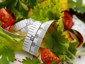 lettuce and tomatoes with tape measure