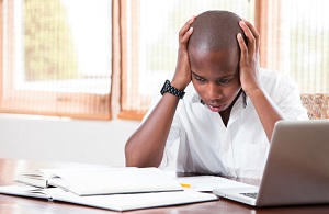 stressed teen attempting to study