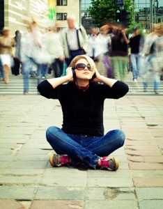 solitary woman in the midst of a busy crowd