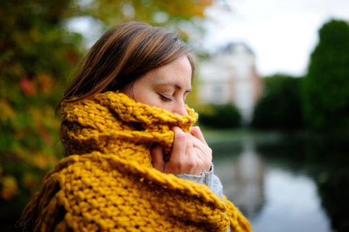 Girl hiding in scarf