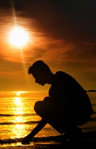 man-on-beach-at-sunset-121813