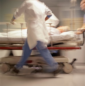 Doctors pushing patient on trolley