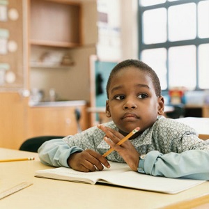 boy daydreaming in class