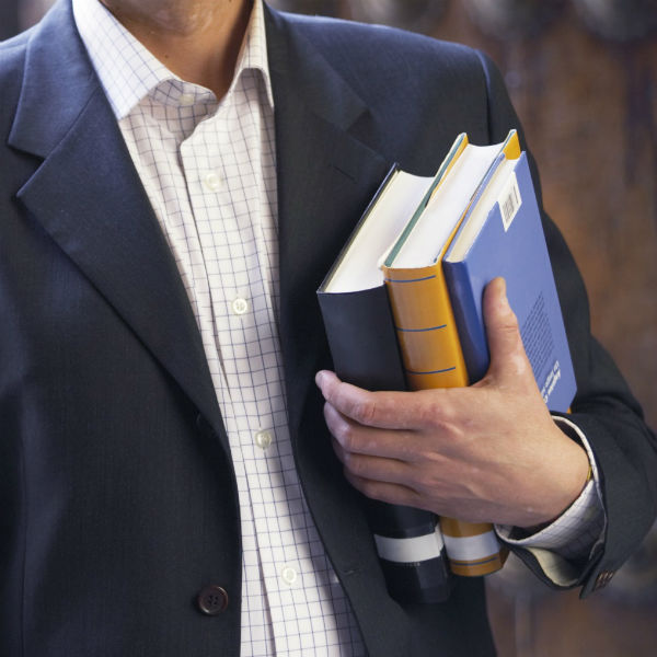 man holding books