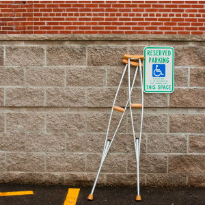 crutches in a handicapped parking space