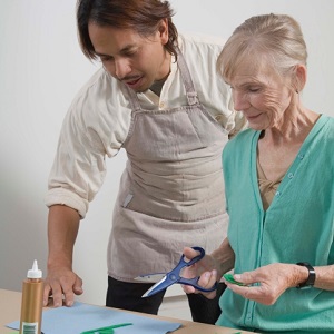 Teacher and woman doing arts and crafts