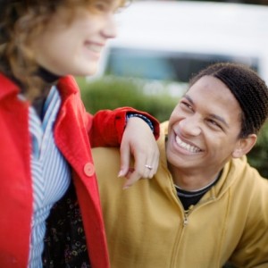 two friends laughing in park