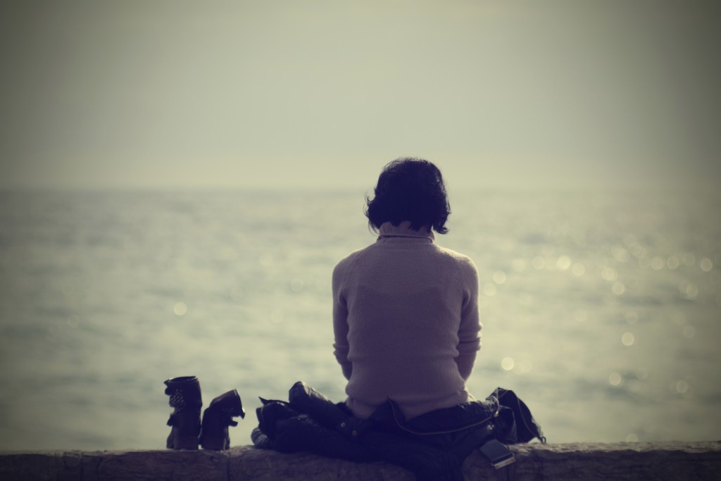 Woman relaxing by water